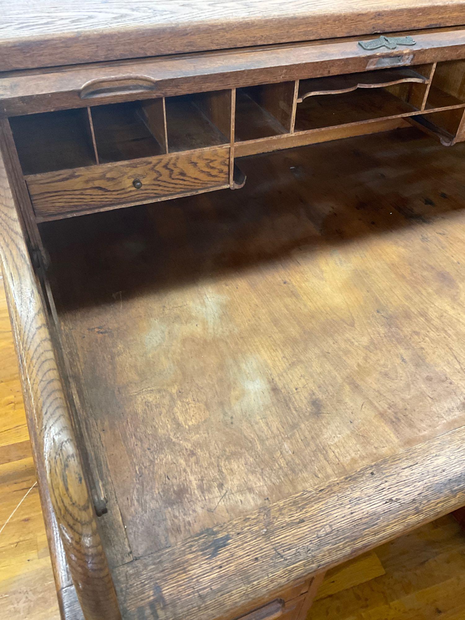 Antique roll top desk by Forest City Furniture Rockford Illinois. 44" x 48" x 34" on casters