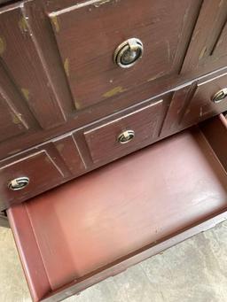 Three drawer wood dresser with metal accents. 32" x 27" x 14"