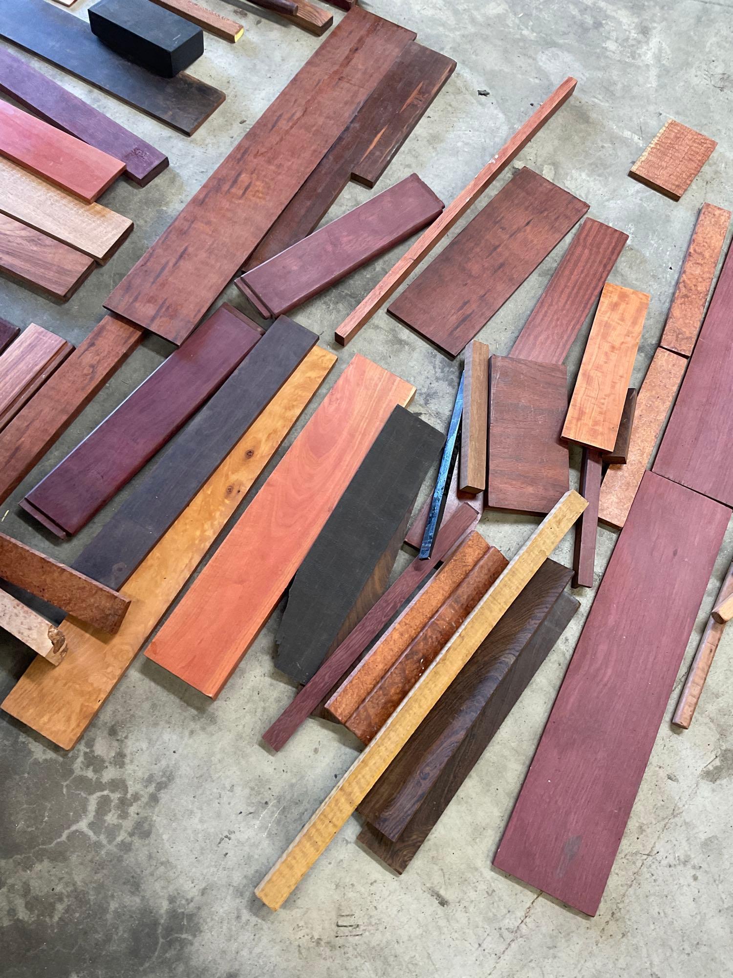 Assorted size and variety of Exotic scrap wood. Over 70 pieces, includes wood trunk 17" x 32" x 16"