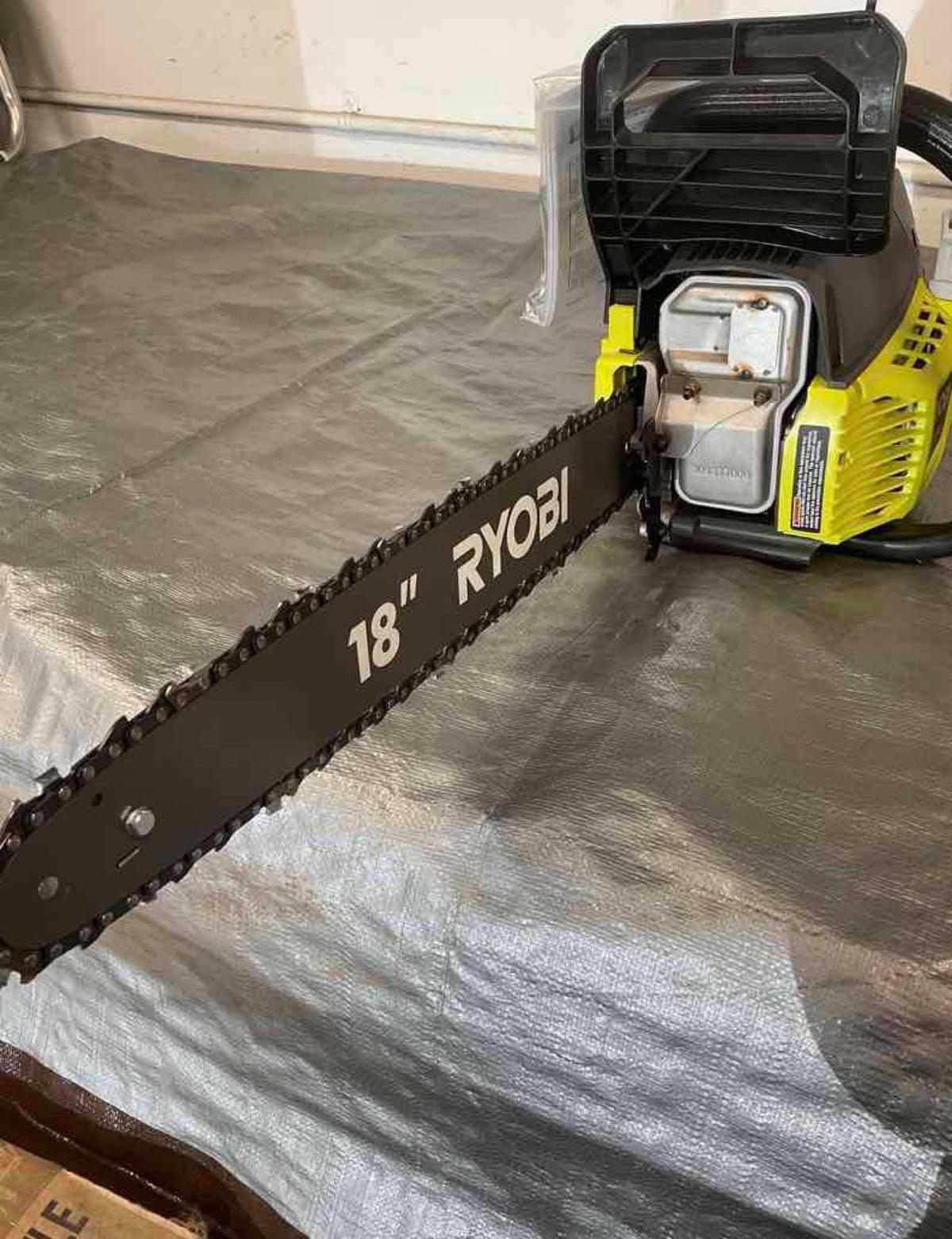 New Ryobi 18 in 38cc chain saw. 72 hr. warranty