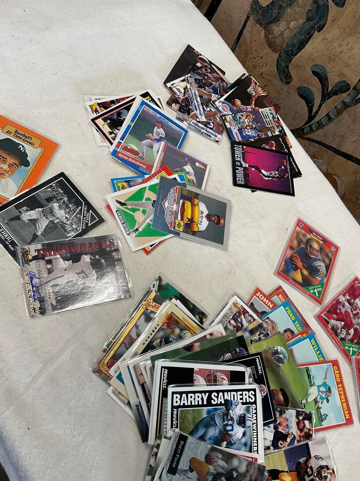Grouping of Collectible football, baseball & basketball cards. Some have soft sleeve