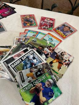 Grouping of Collectible football, baseball & basketball cards. Some have soft sleeve