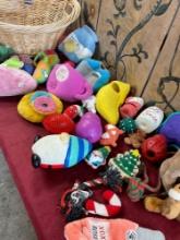 Assorted dog toys and large wicker basket. 30 pieces