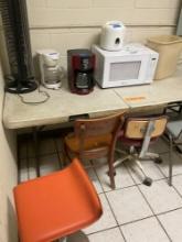 Large lot of kitchen appliances ( majority turned on), chairs, table, etc