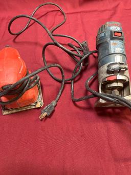 Black & Decker sander & Bosch Colt router. Both turned on