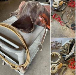 Large lot of horse items. Saddle, Tux head ropes feed bag, halters, leashes, girth, stirrup, etc.