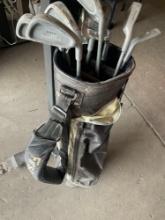 First Flight golf bag and 11 assorted golf clubs