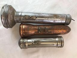 Group of three antique flashlights