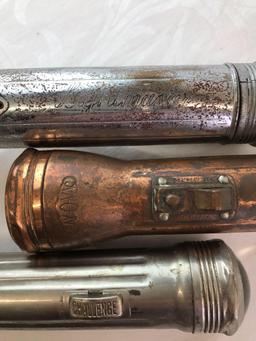 Group of three antique flashlights