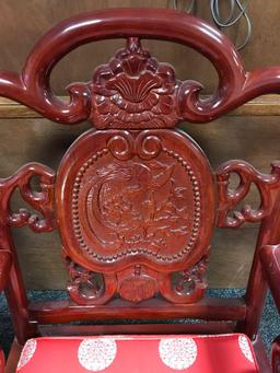 Very ornate red lacquered Asian motif wooden arm chair