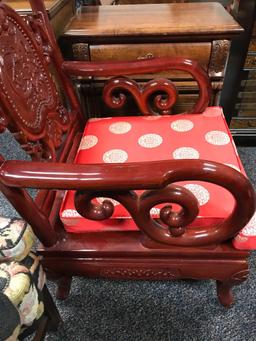 Very ornate red lacquered Asian motif wooden arm chair