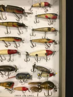 Case with 17 vintage creek chub Lures