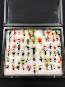 Case with 66 fly fishing popper lures