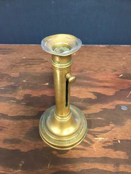 Antique brass candlestick with lever