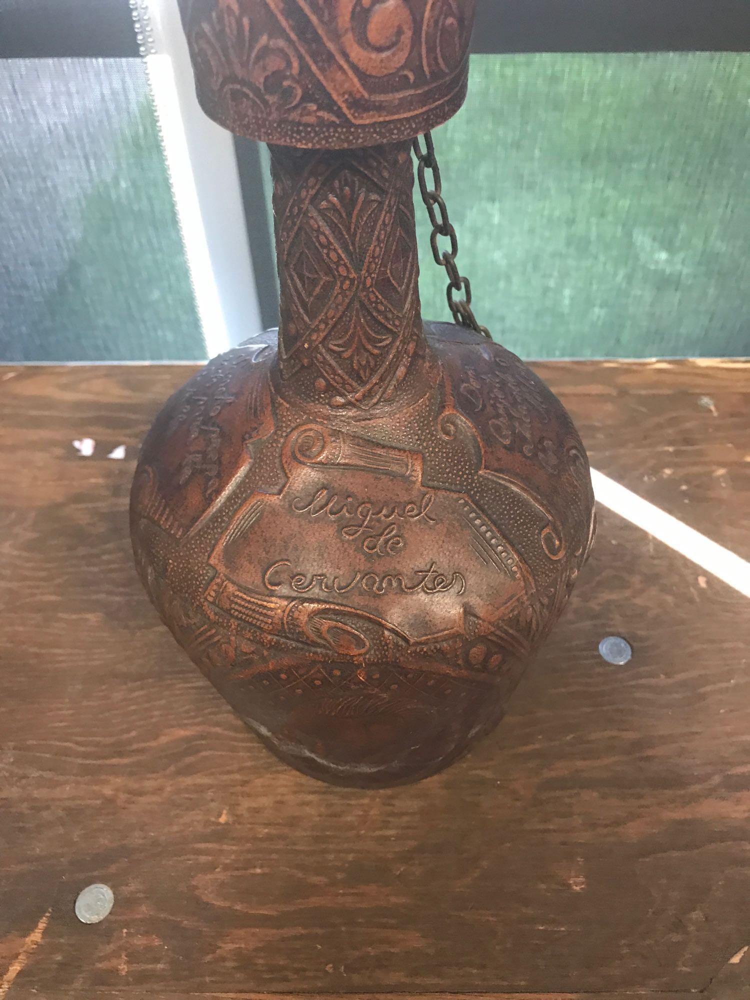 Vintage Spanish leather covered decanter featuring Don Quixote