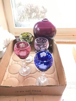 Group of colored cut to clear glass goblets and other