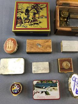 Group of trinket boxes, match boxes, and more