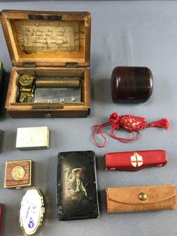 Group of trinket boxes, match boxes, and more