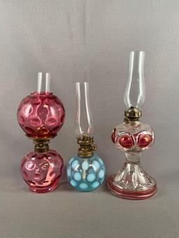 Group of three miniature glass oil lamps