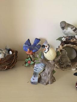 Shelf lot of porcelain birds and more