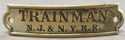 Vintage NJ and NY Railroad trainman hat badge