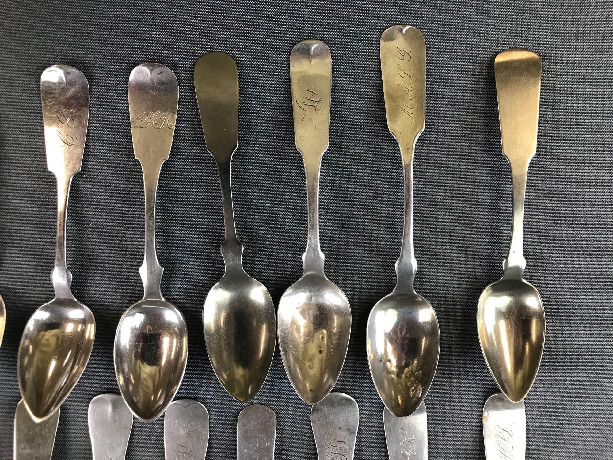 Group of 25 antique sterling or coin silver fiddleback spoons