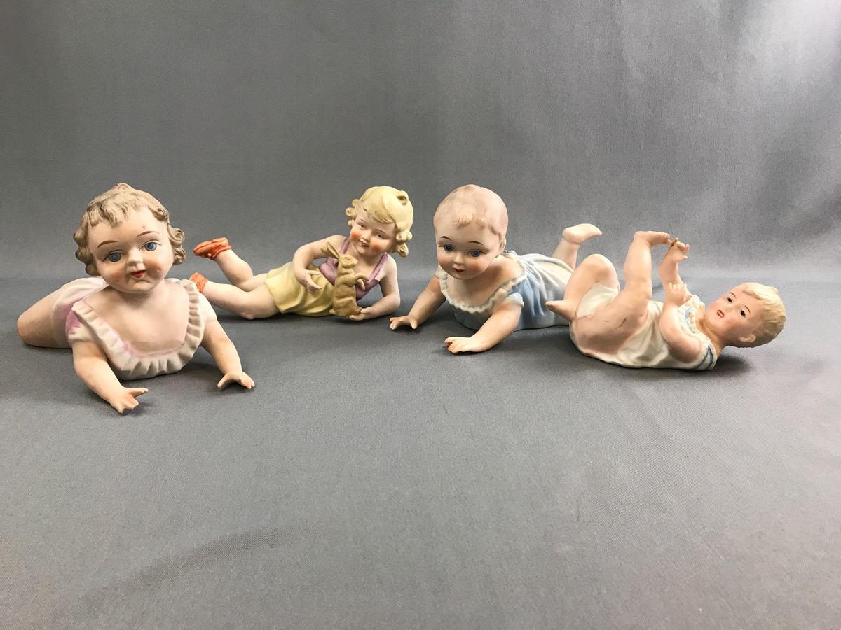 Group of vintage porcelain china piano babies.