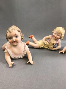 Group of vintage porcelain china piano babies.