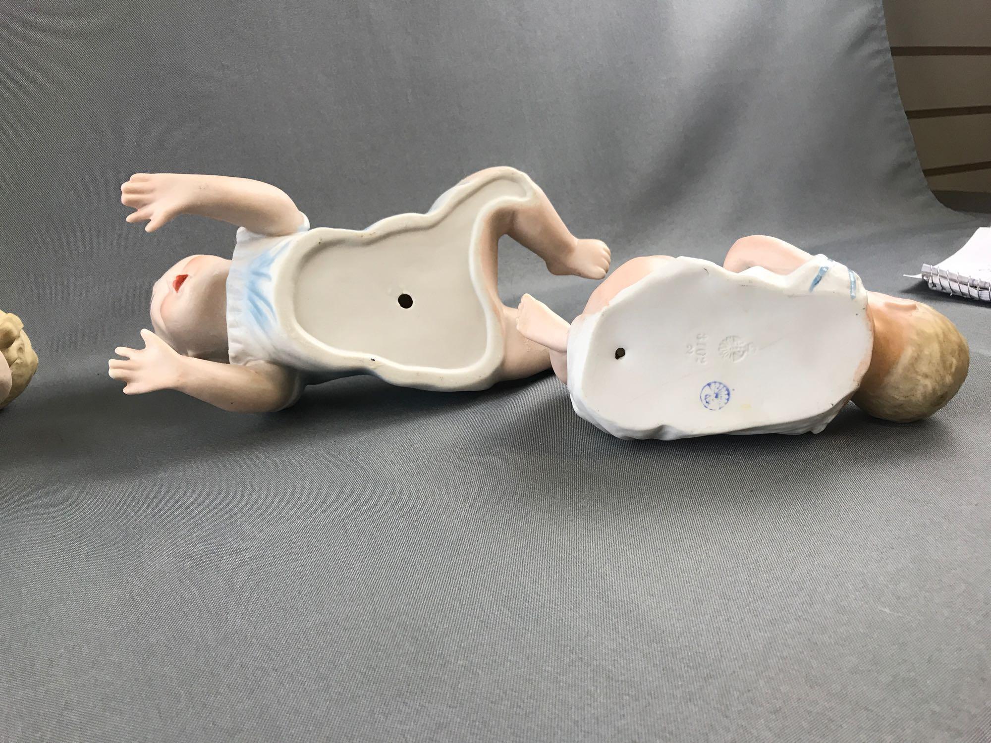 Group of vintage porcelain china piano babies.