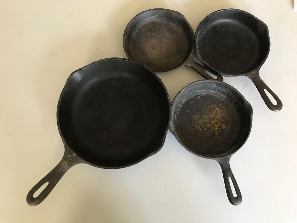 Group of 4 vintage cast iron pans