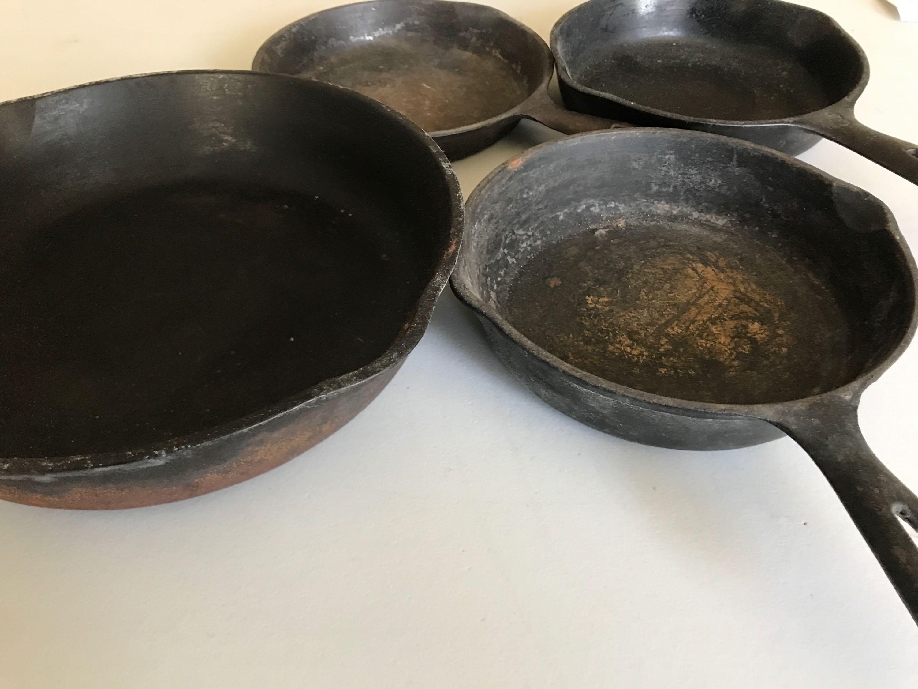 Group of 4 vintage cast iron pans