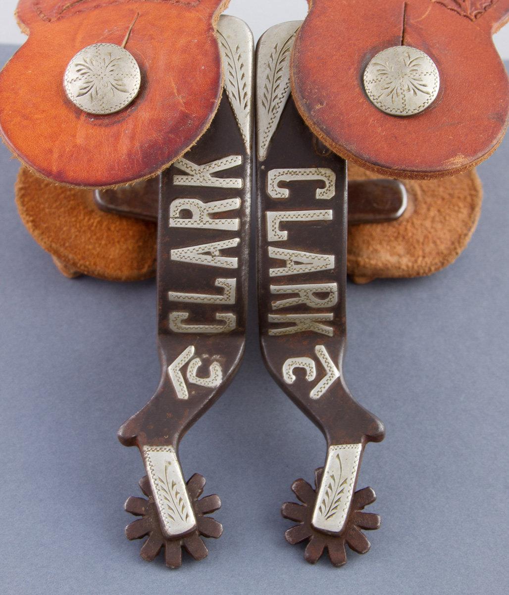 Pair of Billy Klapper, single mounted Spurs, #102, with silver overlaid and etched swing buttons, he