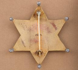 Heavy gold plated, very ornate 6 point ball star Badge for "CHIEF OF POLICE, CHEBOYGAN".  Hallmark "