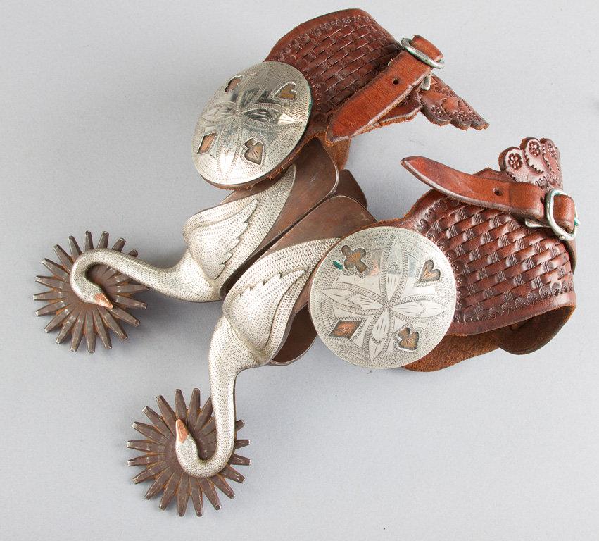 Fancy pair of single mounted Spurs by noted Bit & Spur Maker Randy Butters, #262, with silver hand e