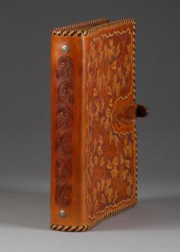 Fantastic carved leather Binder by noted artist, the late Bob Dellis, (1928-2002), 12" x 10 1/2", fl