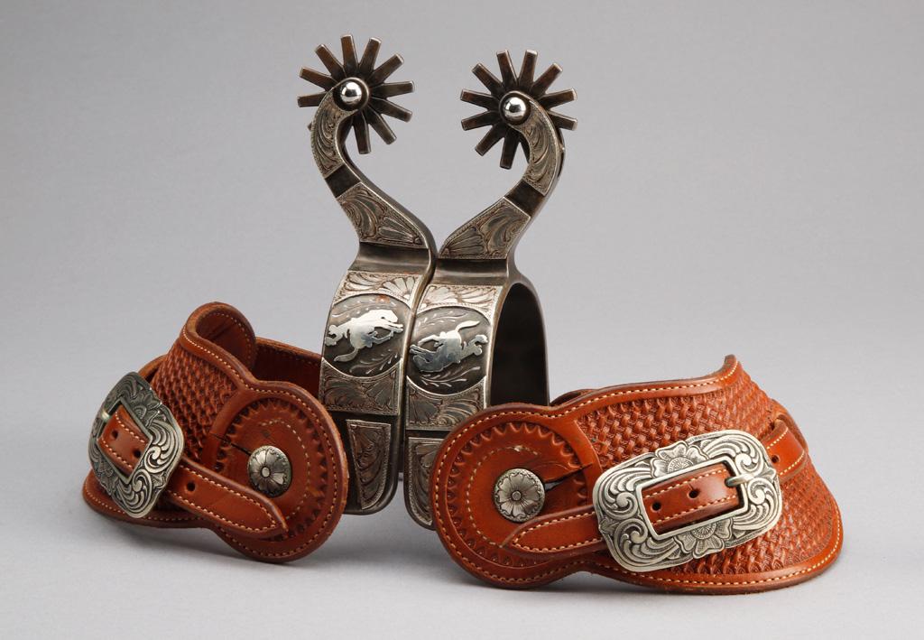 Outstanding pair of Gary Blackwood, Texas marked single mounted, hand engraved silver overlay Spurs