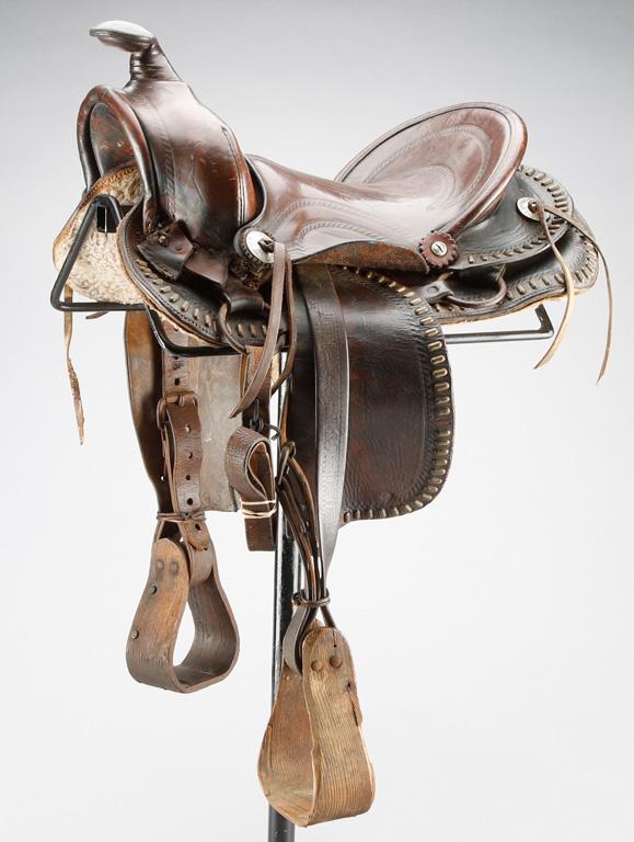 Two unique vintage Saddles: One is a spotted Childs Saddle marked "Estaboshed 1879 Service";  The ot