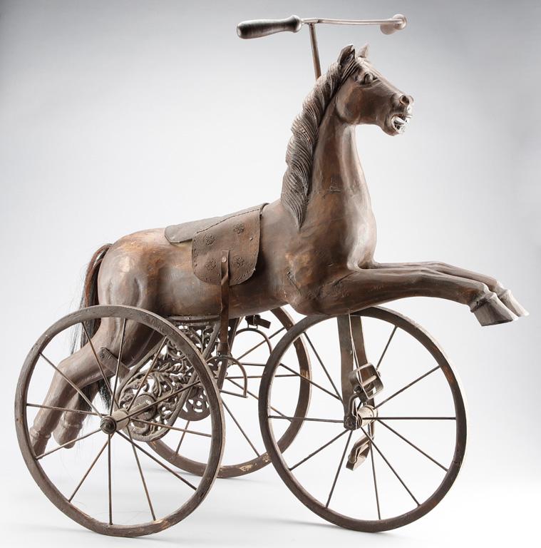 Very unique Wooden Horse Tricycle with horse hair tail and ornate wheel brackets, leather saddle, ir
