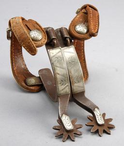 Pair of "Kelly" marked single mounted Spurs, hand engraved silver overlay, sold with vintage two pie