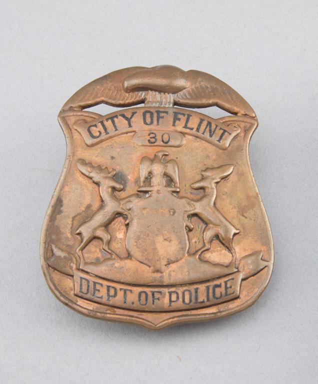 City of Flint, #30, Dept. of Police Badge, brass shield with eagle crest, 2 1/2" T.  George Jackson