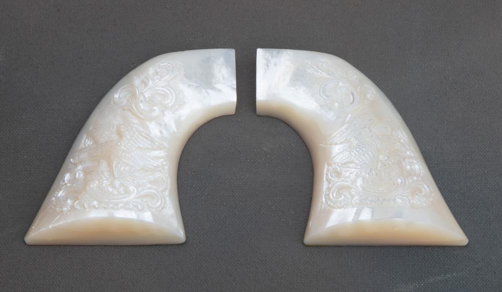 Extremely fine pair of highly carved mother of pearl grips for a SAA Revolver, grips are floral carv