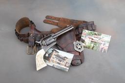 An historical Arizona Territory shipped Colt SAA Revolver with carved pearl grips and Holster Rig.