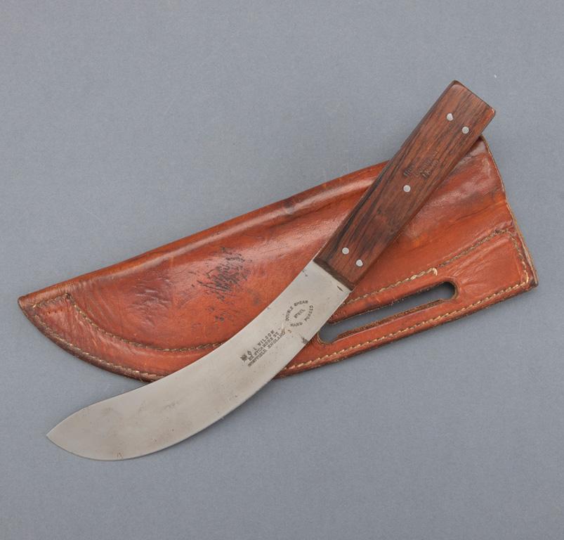Skinning Knife with rosewood handles, handles held with German silver pins and marked "Hudson Compan