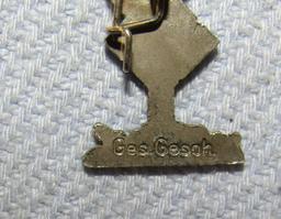 Enamel Afrika Korps Palm Tree Lapel Pin "Ges. Gesch."