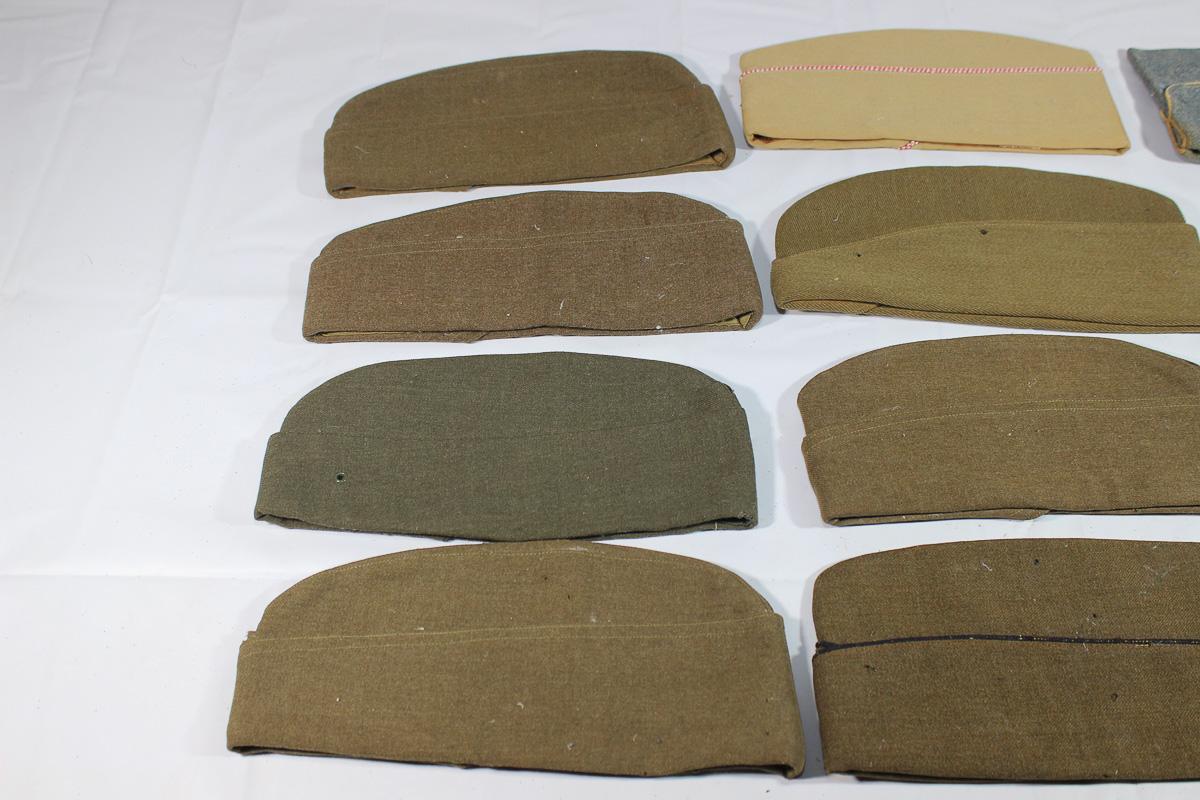 Lot of 12 US WW2 Overseas Garrison Caps. 1 French. 1 WW1 Cap. All Show Damage.