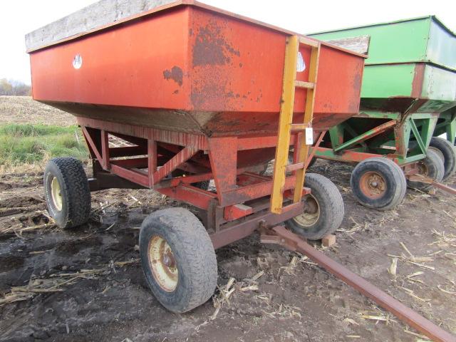 823. J&M 200 Bushel +/- Gravity Bon on Harms Four Wheel Wagon