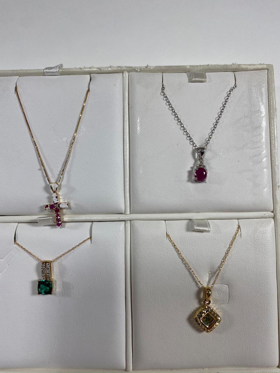 Necklaces on various chains. Estimated Retail Value of $2,370.00 for all 12 necklaces.