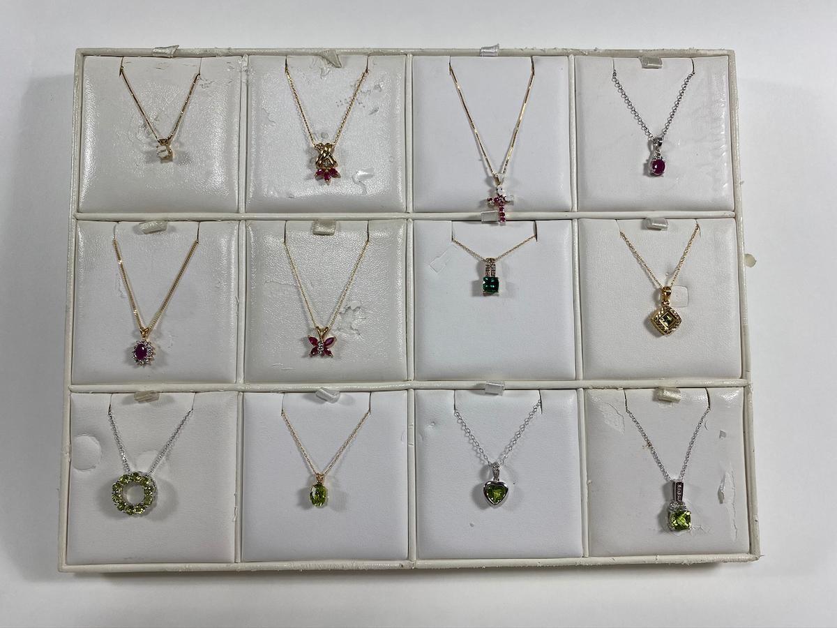 Necklaces on various chains. Estimated Retail Value of $2,370.00 for all 12 necklaces.