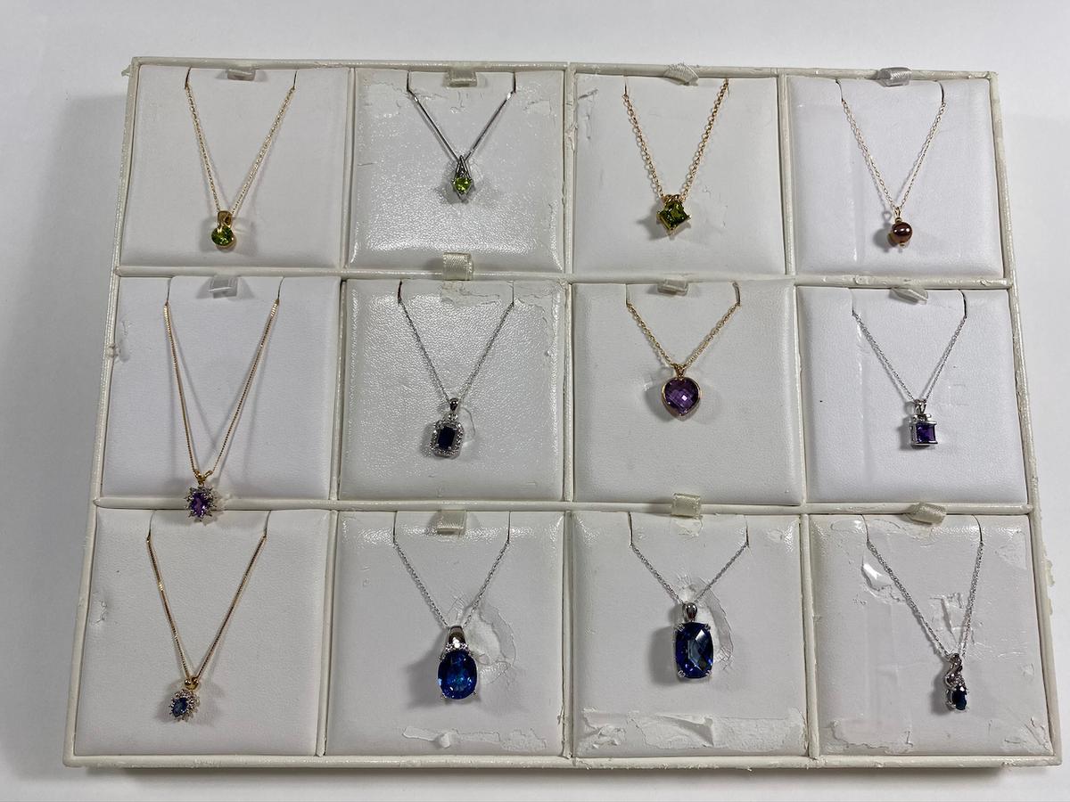 Necklaces on various chains. Estimated Retail Value of $2,150.00 for all 12 necklaces.