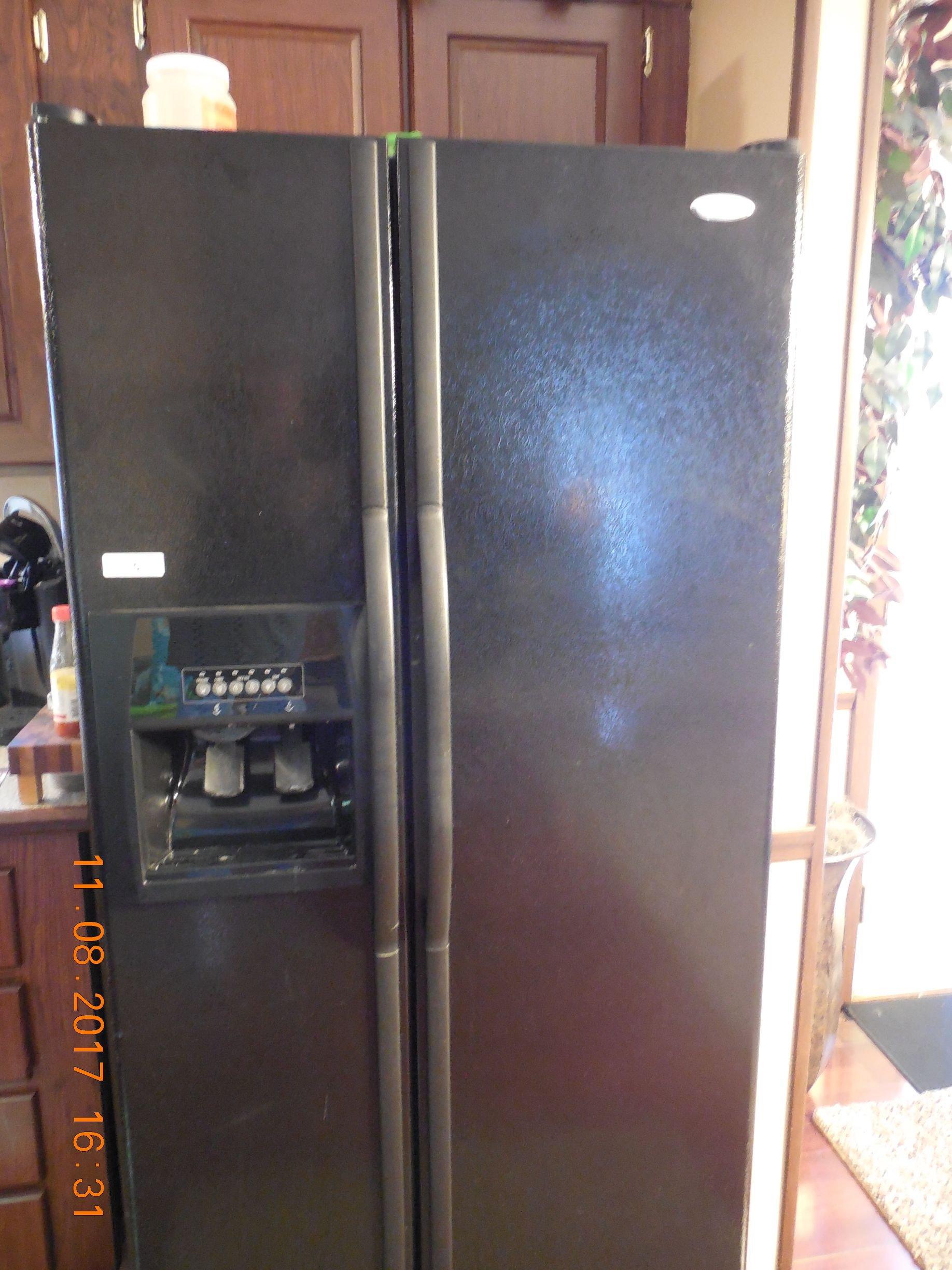 Black Side by Side Whirlpool Refrigerator.